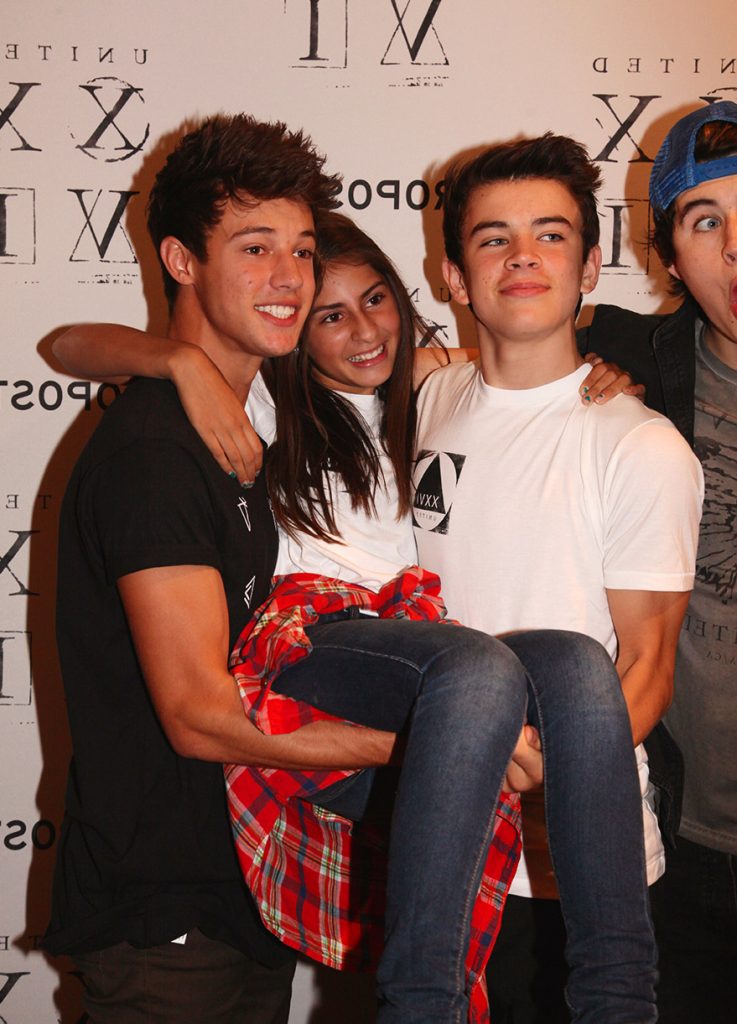 Cameron, Hayes and Nash pick girl up.