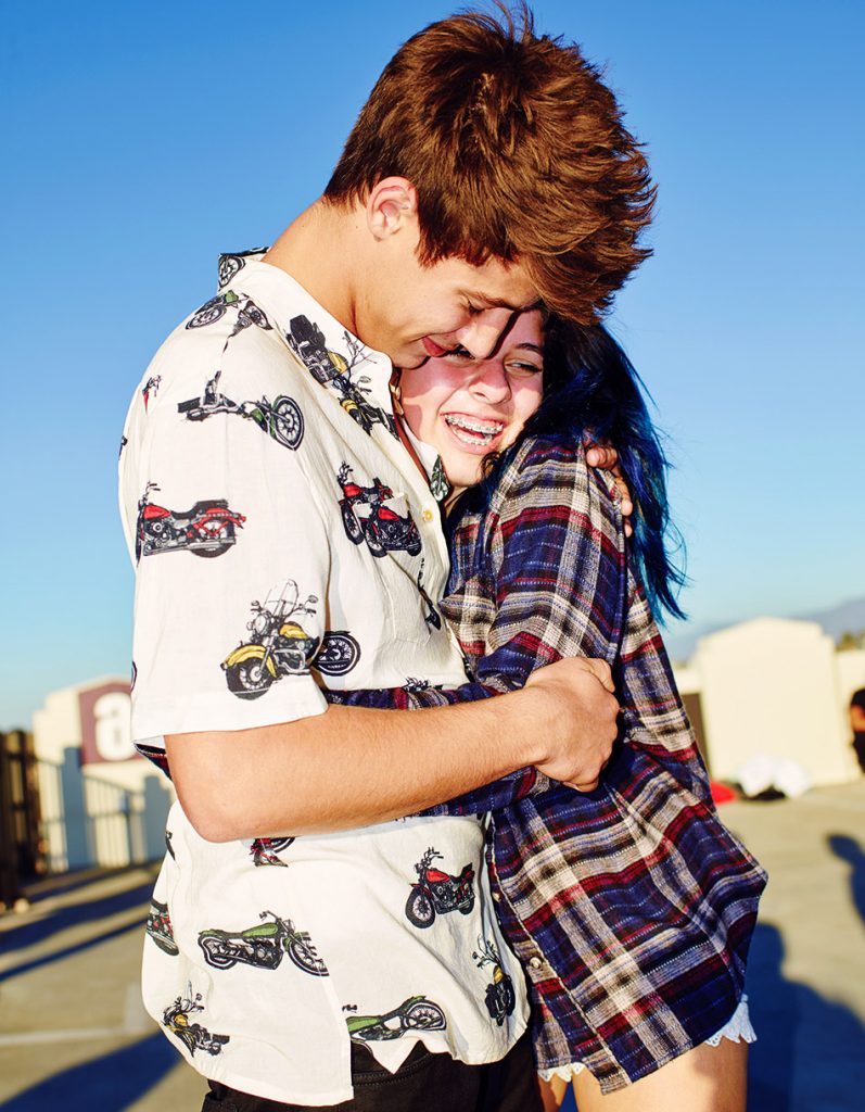 Cameron Dallas hugs fan.