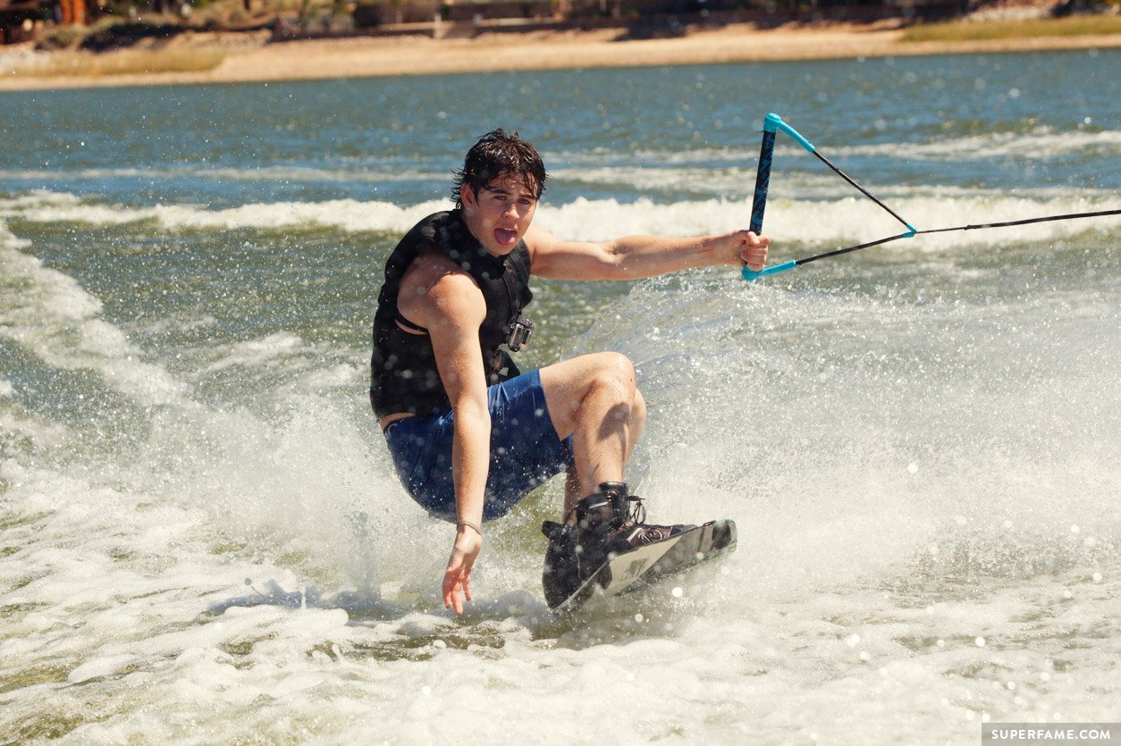 Nash Grier wakeboarding in water.