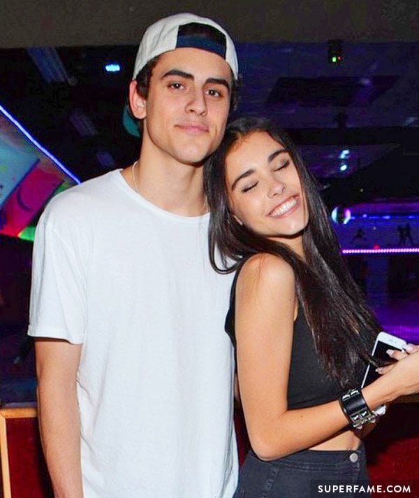 Madison Beer leans into Jack Gilinsky at a party. 