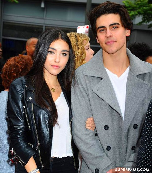 Madison Beer holds onto Jack Gilinsky.