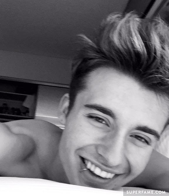 Christian Collins shirtless in bed. (Photo: Snapchat)