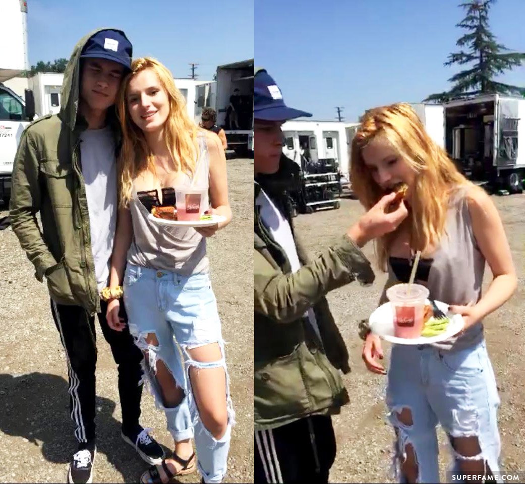 Kian Lawley feeds Bella Thorne.