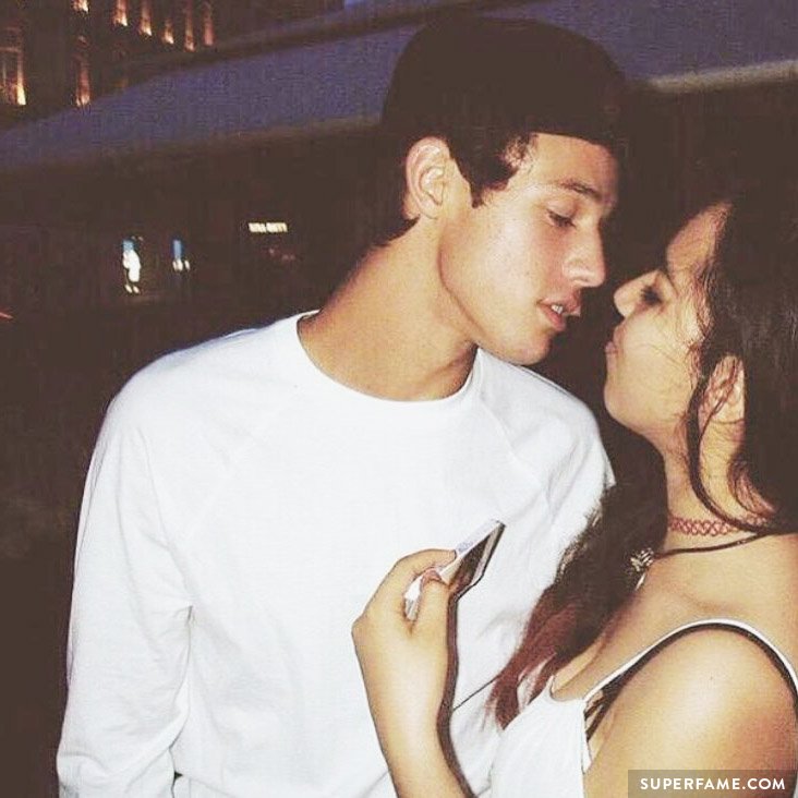 Cameron Dallas teases a fan with a kiss.