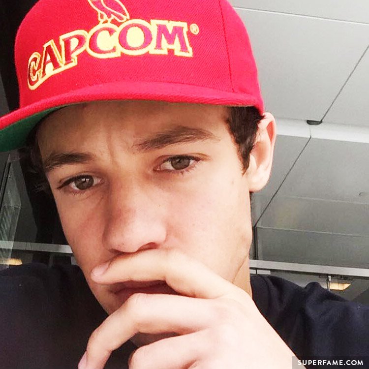 Cameron Dallas wears a Capcom hat.