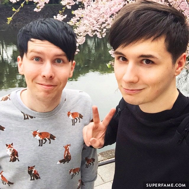 Dan and Phil admire cherry blossoms.