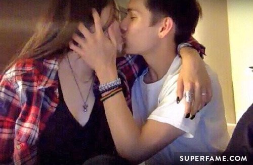 Maggie and Carter kissing.