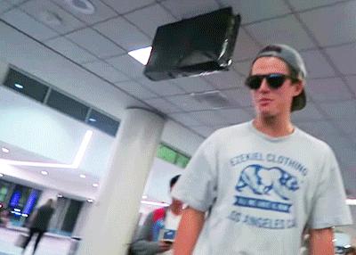 iJustine bumps into a hoverboarding Kenny Holland at the airport.