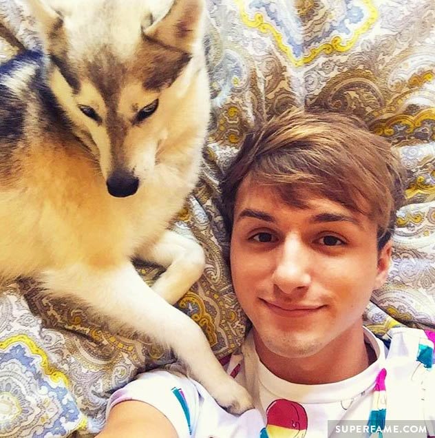 Lucas Cruikshank hangs out with a dog.