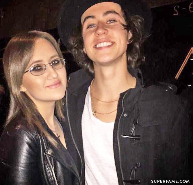 Stalker Sarah poses with Nash Grier outside.