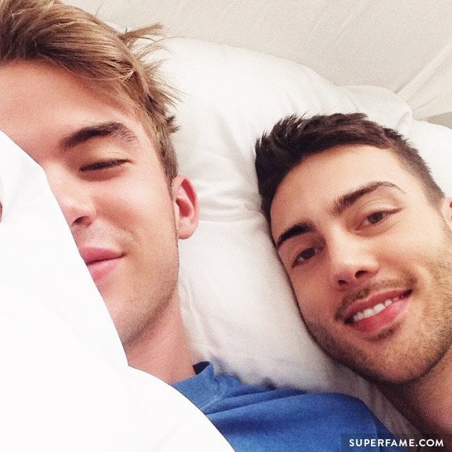 Aaron Rhodes in bed with Travis Bryant.