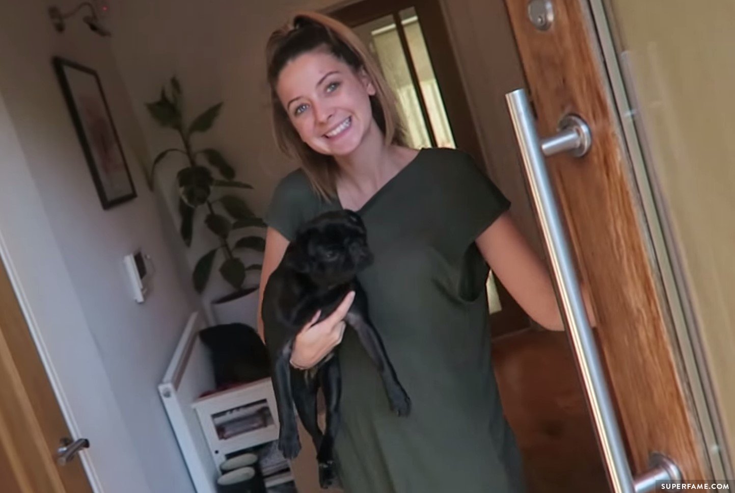 Zoella greets Alfie when he gets home.