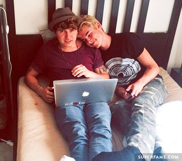 JC on his laptop with Kian.
