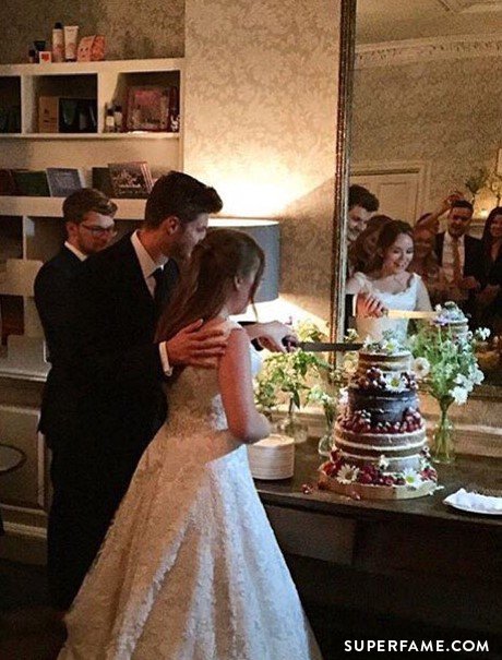 Jim and Tanya cutting the cake.