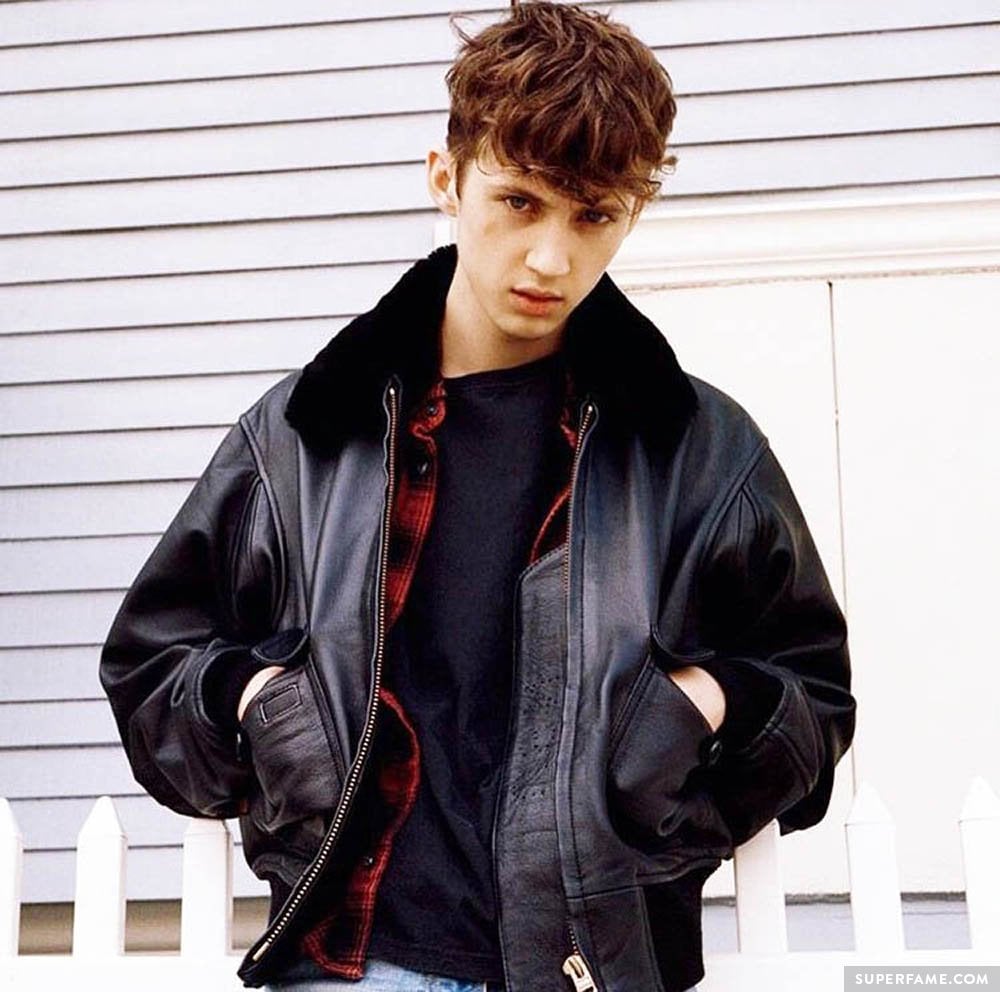 Troye Sivan looking tough in a leather jacket.
