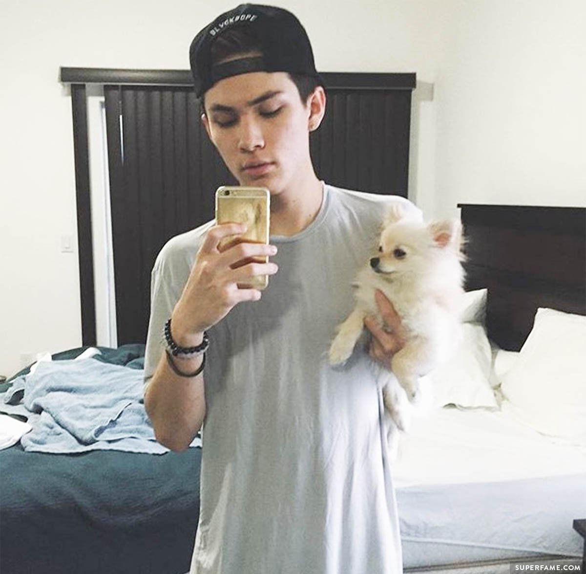 Carter Reynolds holds a dog.