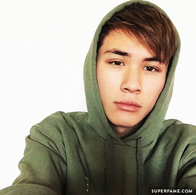 Carter in a green hoodie.