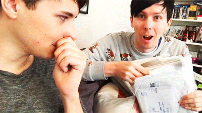 Dan and Phil see their book for the first time.