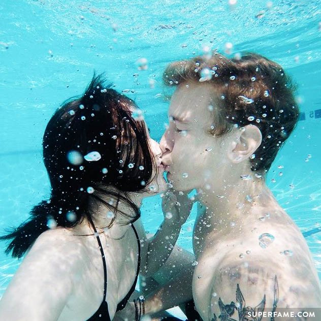 Jairus kisses Acacia in the swimming pool.