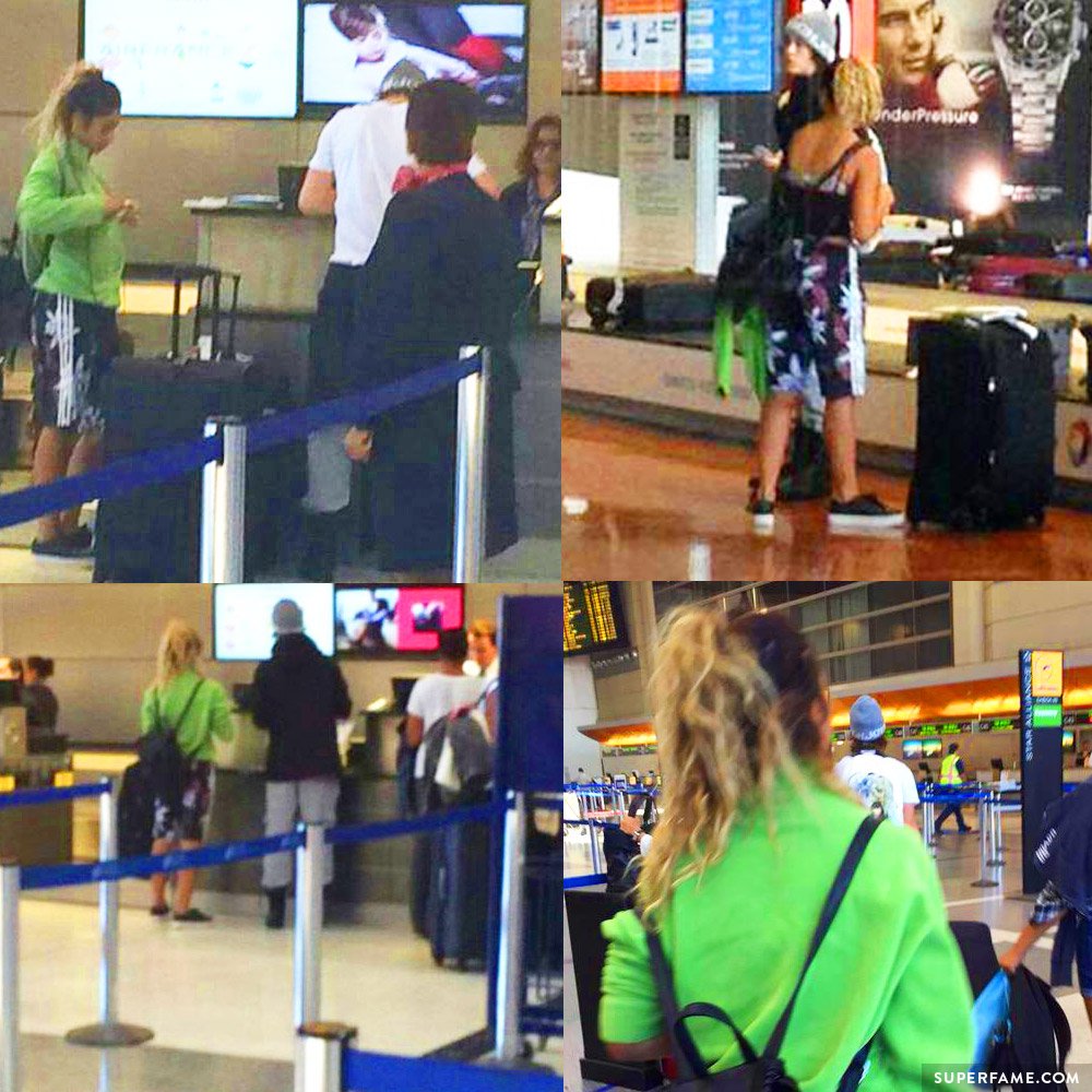 Fans follow Nash and Taylor around the airport.