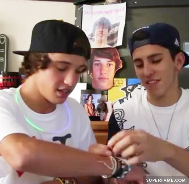 Cameron and Chris admire their bracelets.