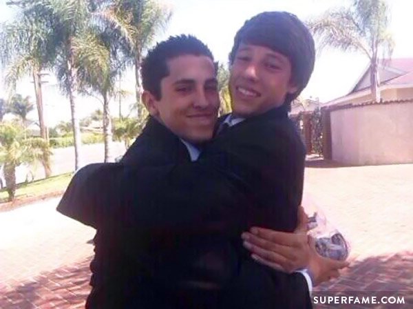 Chris Gonzalez and Cameron Dallas hugging.