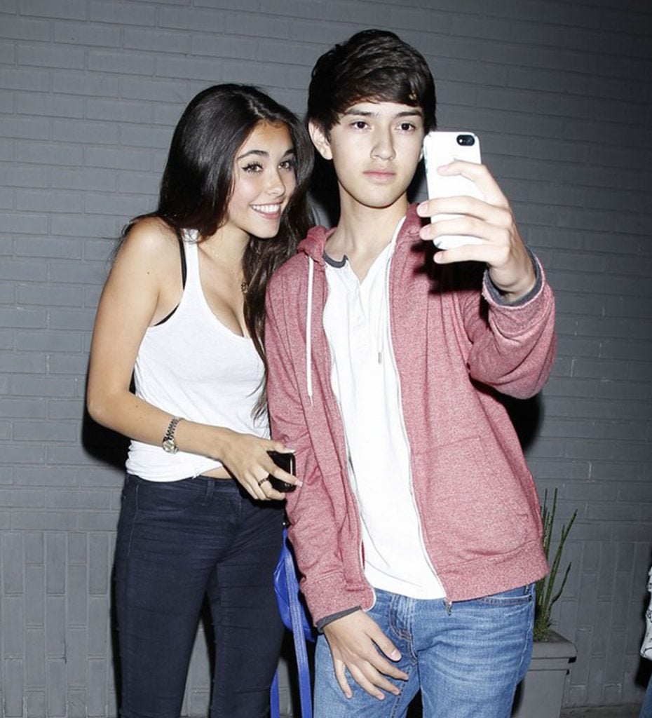 Madison Beer with a fan.