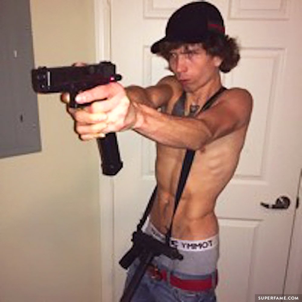 Bryan Silva with a gun.