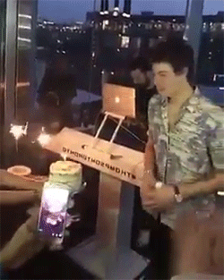 Shawn Mendes blows candles.